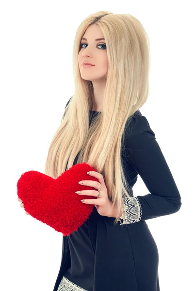 Beautiful blonde woman holding red heart — Stock Photo, Image