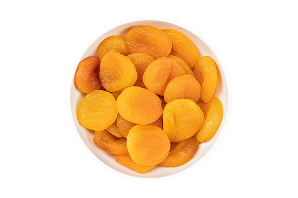 Getrocknete Aprikosen in einer Schüssel auf weißem Hintergrund — Stockfoto