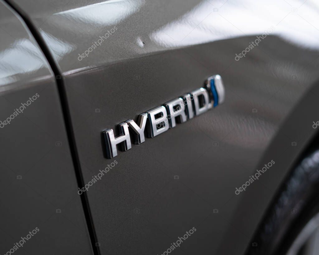 Hybrid car Logo on the back side of automobile.
