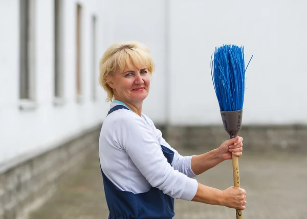 Worker's portrait cleaning city street with broom tool — Stock Photo, Image