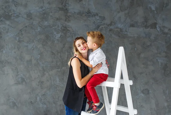 Mother and blond son on a step-ladder — Stock Photo, Image