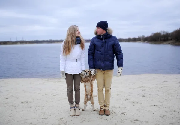 Guy, girl and dog — Stock Photo, Image