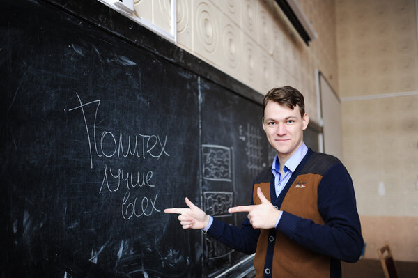 the student solves a problem on a board