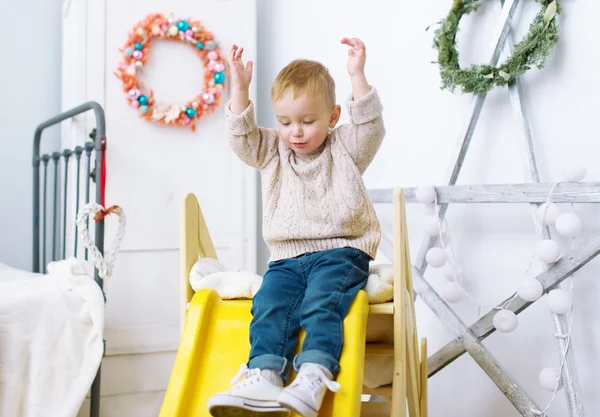 The kid plays in a nursery. — Stock Photo, Image