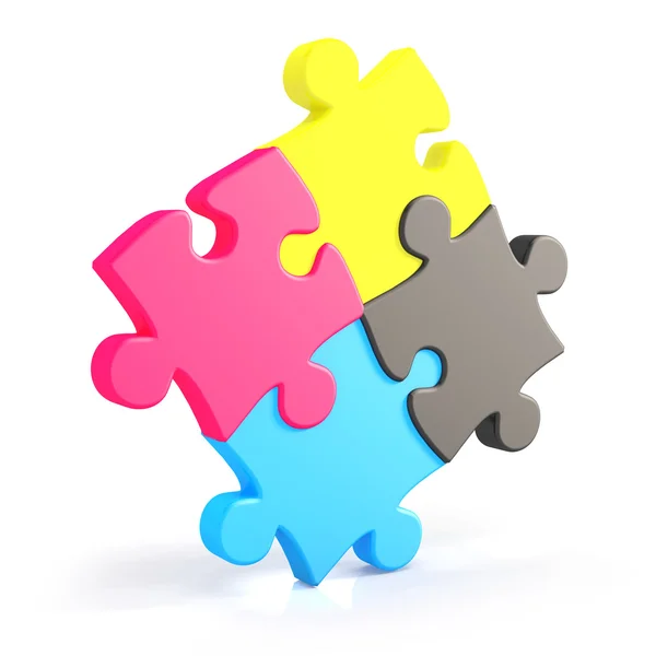 Four assembling colorful puzzle pieces in cmyk — Stock Photo, Image