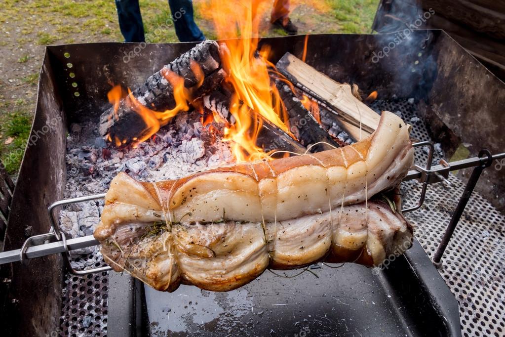 Roasted pig on a spit Stock Photo by ©vpardi 104624570