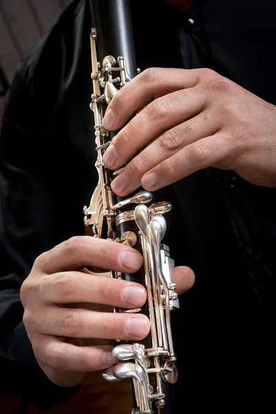 Hands of a clarinet player — Stock Photo, Image