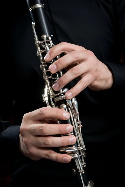 Hands of a clarinet player — Stock Photo, Image