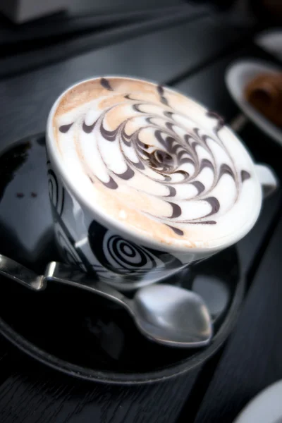 Cappuccino with chocolate in cup — Stock Photo, Image