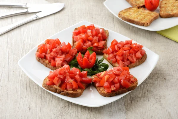 Friselle with tomatoes — Stock Photo, Image