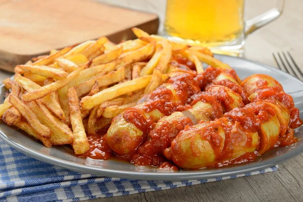 Sausages with potatoes fries — Stock Photo, Image