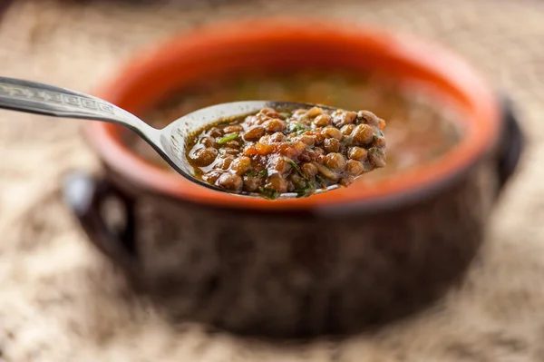 Sopa de lentejas con cuchara —  Fotos de Stock