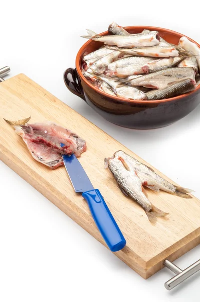 Fish filleted with a knife on board — Stock Photo, Image