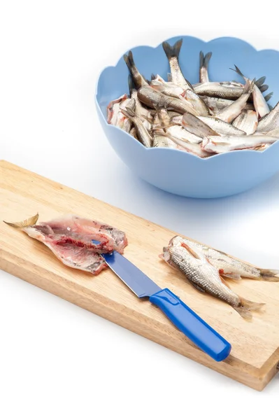 Fish filleted with a knife on board — Stock Photo, Image