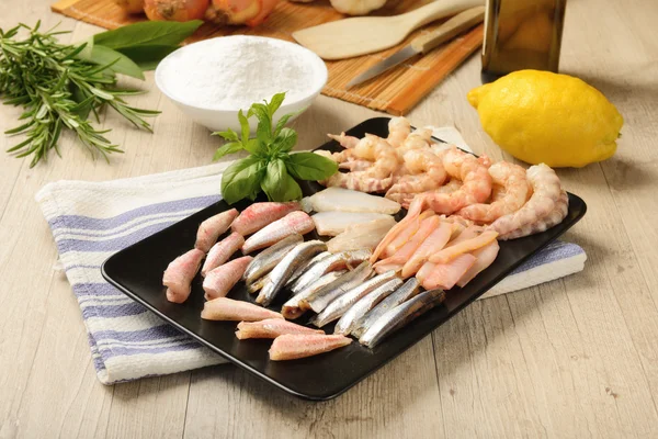 Raw fish on plate — Stock Photo, Image