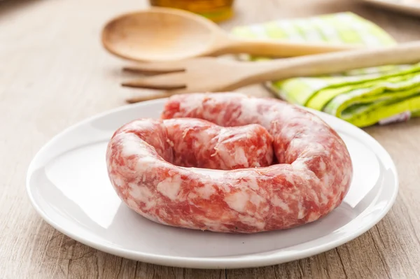 Raw sausage in a dish — Stock Photo, Image