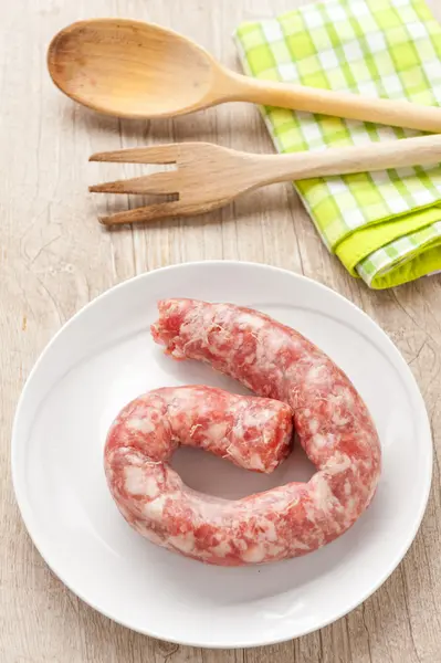 Raw sausage in a dish — Stock Photo, Image