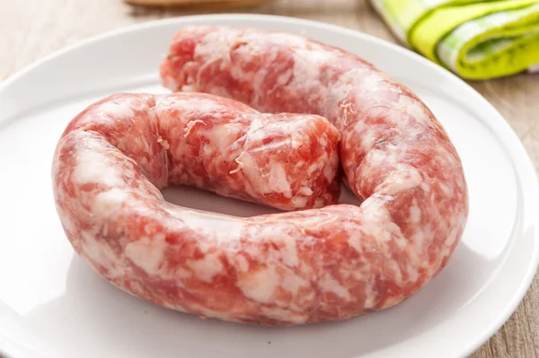 Raw sausage in a dish — Stock Photo, Image