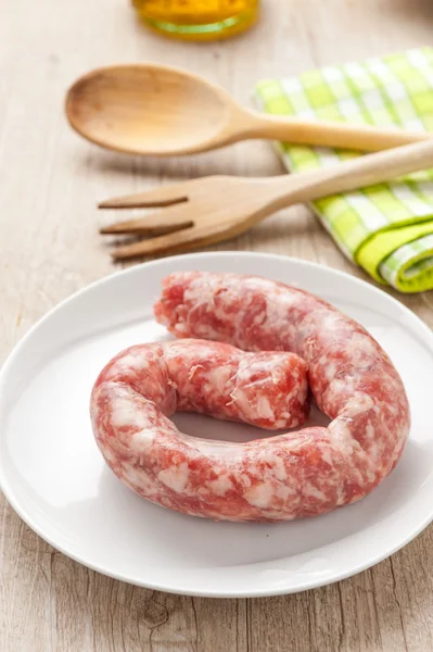 Raw sausage in a dish — Stock Photo, Image