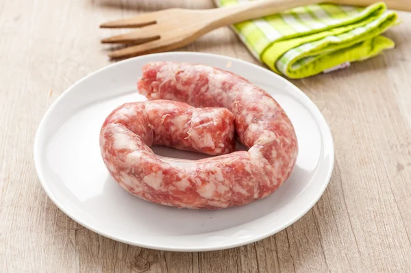 Raw sausage in a dish — Stock Photo, Image