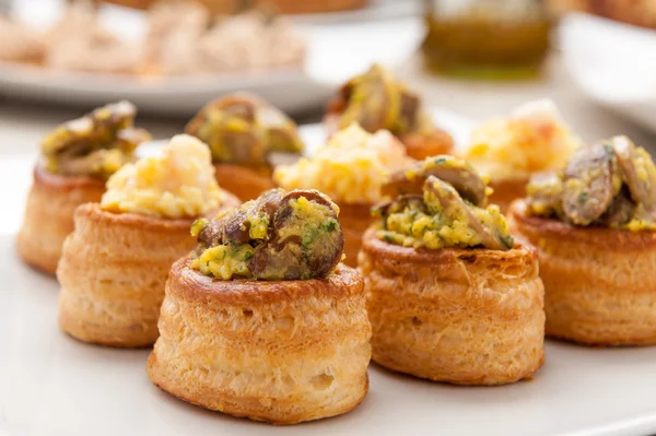 Vol-au-vent stuffed on white plate — Stock Photo, Image