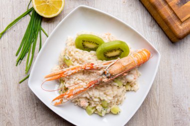 Risotto with prawns and kiwi clipart