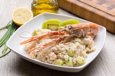 Risotto with prawns and kiwi clipart