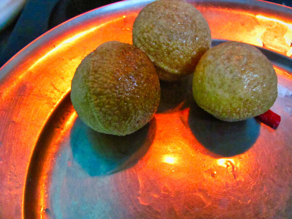 Panipuri is a common street snack from India. It's a round, hollow puri filled with a mixture of flavoured water and other chat items. It is also called Golgappa