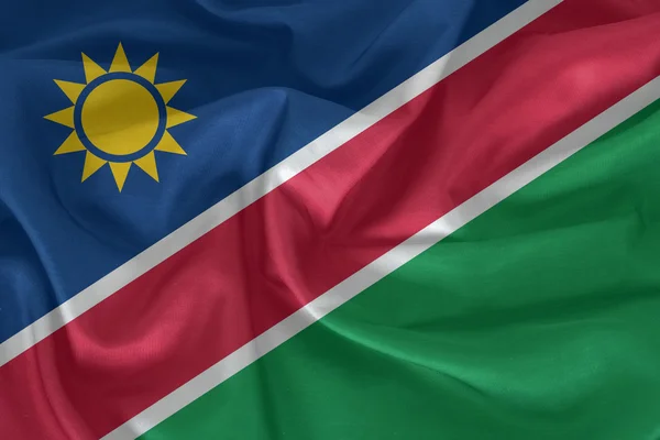 Namibias flagga mönster på tyg konsistens — Stockfoto