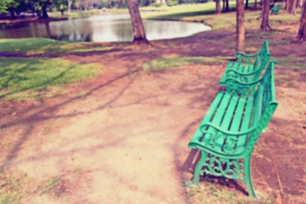 Blur of Bench under the tree in the Gardens — Stock Photo, Image