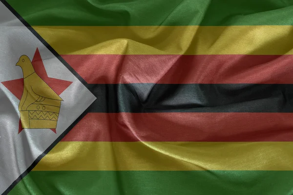 Zimbabwe flag pattern on the fabric — Stock Photo, Image