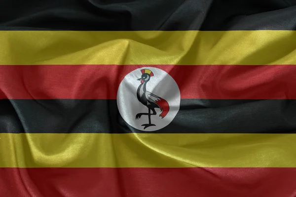 Uganda flagga mönster på tyg konsistens — Stockfoto