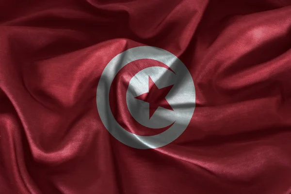 Tunísia bandeira padrão na textura do tecido — Fotografia de Stock