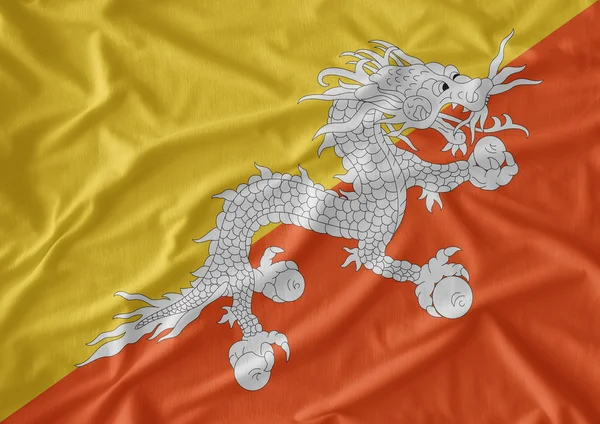 Waving Fabric Flag of Bhutan — Stock Photo, Image