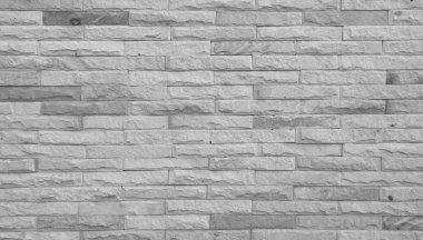 Soyut yıpranmış doku, eski açık gri alçı boyası ve kırsal odada eskimiş beyaz tuğla duvar arka planı, kirli paslı taş işçiliği teknolojisi duvar kağıdı rengi yatay mimari duvar kağıdı.