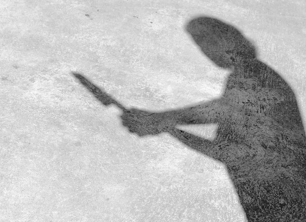 Una sombra en la pared, agarrando el cuchillo — Foto de Stock