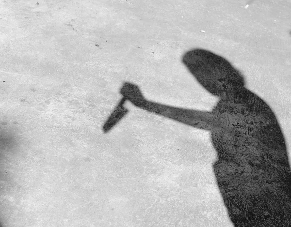 Un'ombra sul muro, stringendo il coltello — Foto Stock