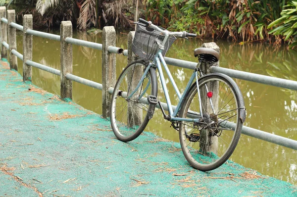 Vintage bicycle on road — Stock Photo, Image