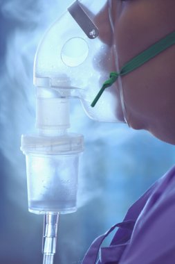 Blur photo of Sick child makes inhalation mask clipart
