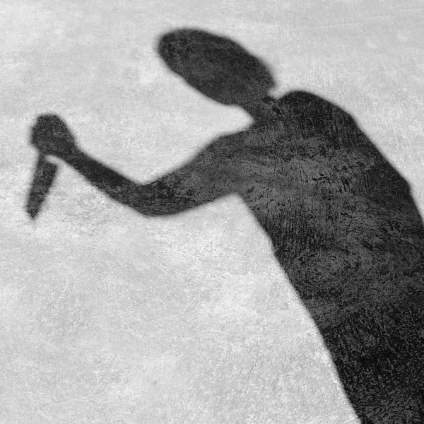 Shadow man raised a knife to stab — Stock Photo, Image