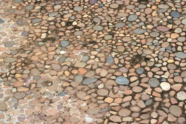 Dekorative Bodenmuster aus Kiessteinen, Kies Textur Hintergrund — Stockfoto