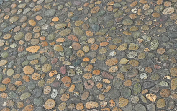 Dekorative Bodenmuster aus Kiessteinen, Kies Textur Hintergrund — Stockfoto