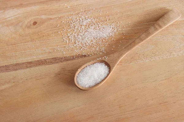 White sugar in wood spoon — Stock Photo, Image