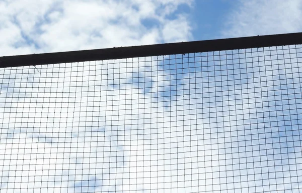 Silhouette of Structure mesh metal fence