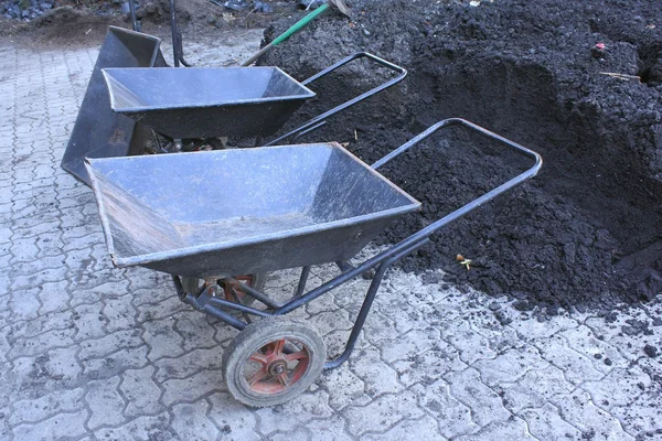 Wheelbarrow or construction tools — Stock Photo, Image