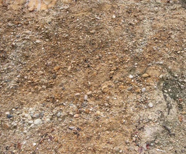 Detalle de la textura de la superficie con roca de guijarro pequeña en tierra sucia . —  Fotos de Stock