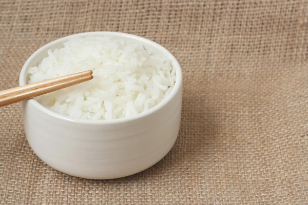 Bowl of rice with chopsticks — Stock Photo, Image