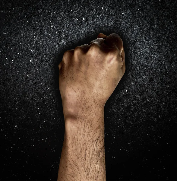 Man hand fist on dark background — Stock Photo, Image