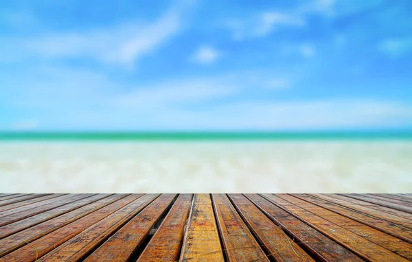 Wooden plank with beautiful beach — Stock Photo, Image