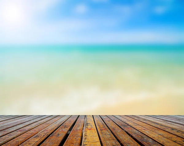 Wooden plank with beautiful beach — Stock Photo, Image